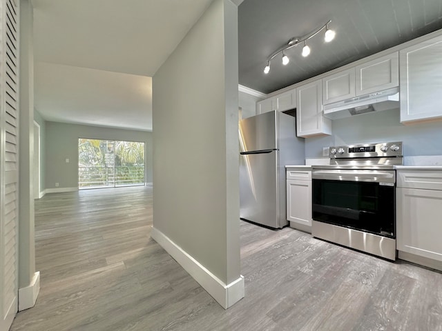 kitchen with appliances with stainless steel finishes, light hardwood / wood-style flooring, white cabinets, and rail lighting