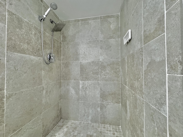 bathroom with tiled shower