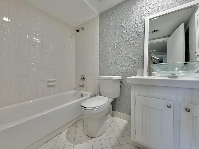 full bath with a textured wall, toilet, tile patterned floors, bathtub / shower combination, and vanity