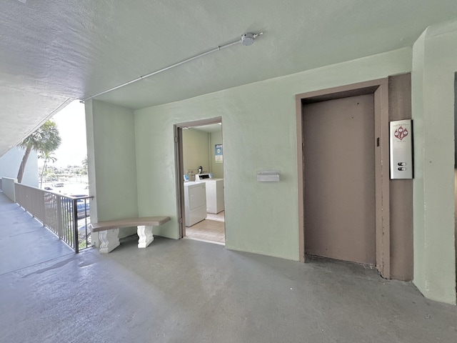 interior space with washer and clothes dryer