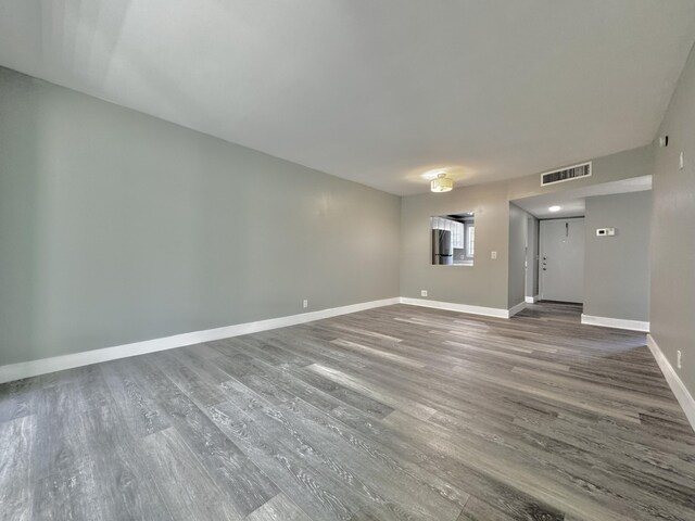 unfurnished living room featuring hardwood / wood-style floors