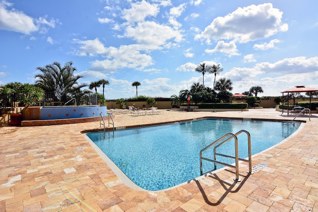 view of swimming pool featuring a patio area