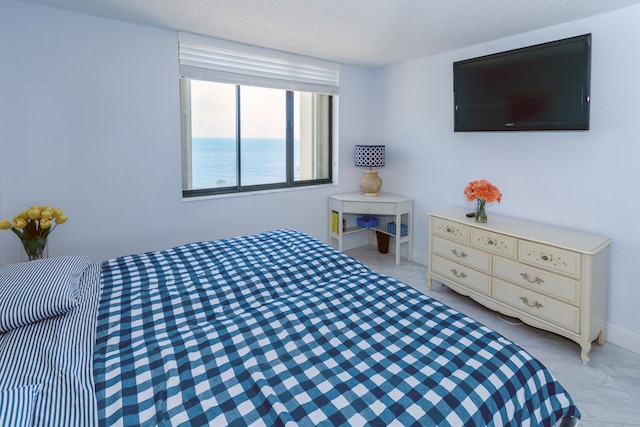 bedroom featuring a textured ceiling