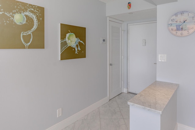 hallway featuring tile patterned floors