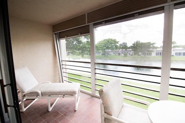 sunroom with a water view