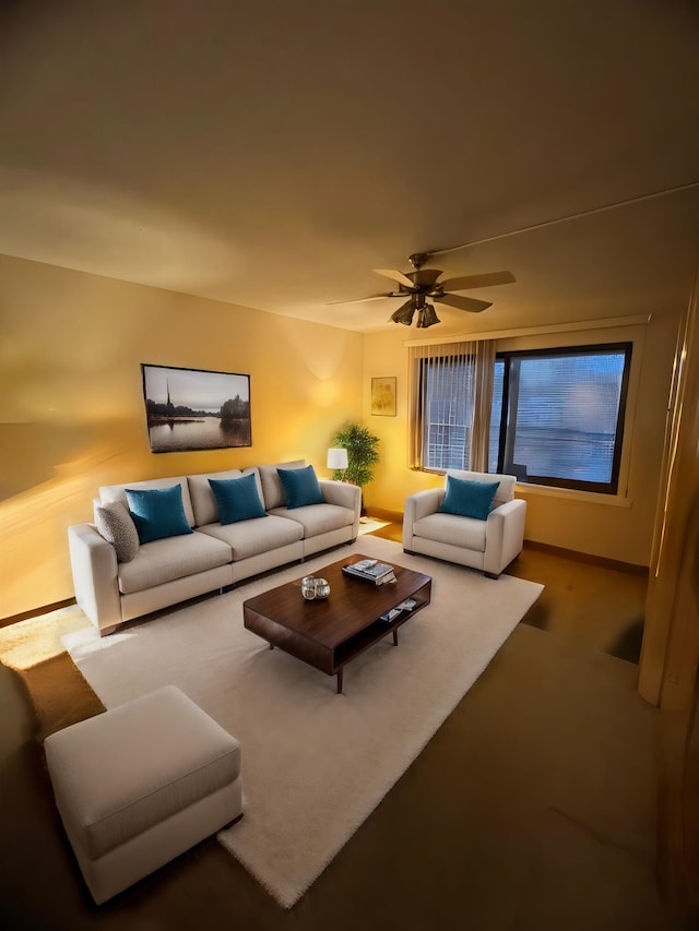 carpeted living room with ceiling fan