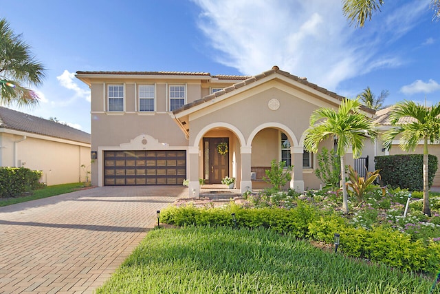 mediterranean / spanish-style house featuring a garage