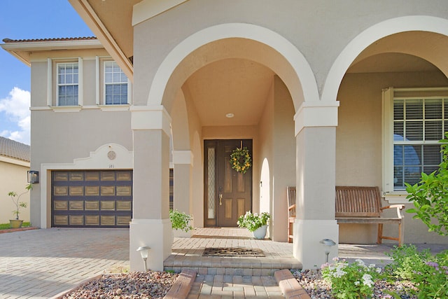 entrance to property featuring a garage