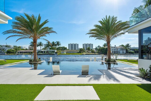 view of pool with a water view