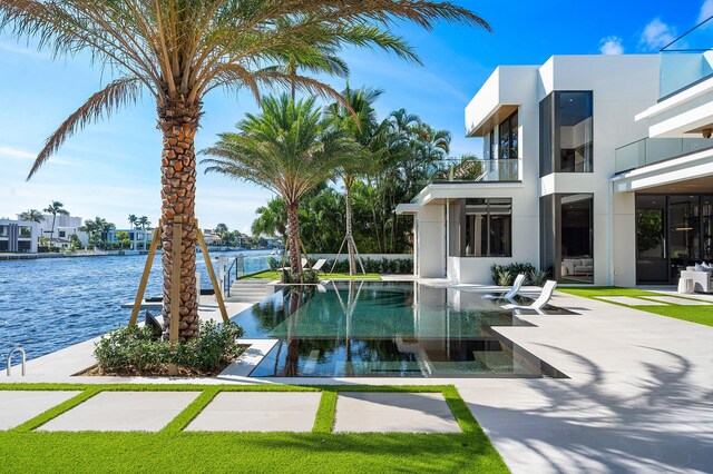 view of pool featuring a water view