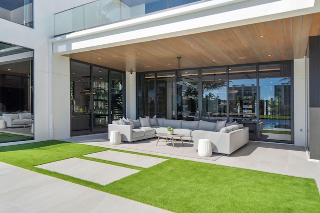 unfurnished living room featuring wood ceiling, floor to ceiling windows, and light tile patterned floors