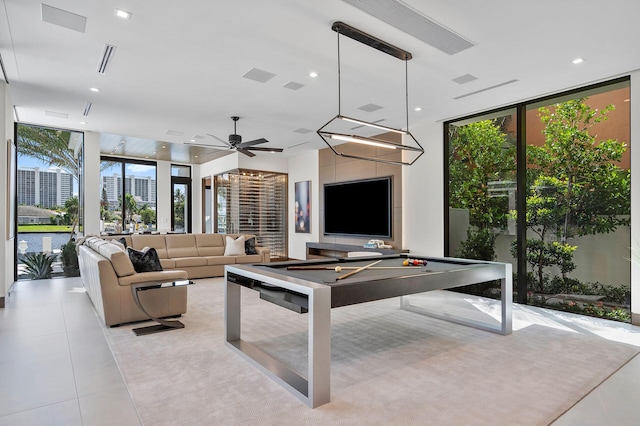 interior space with pool table, floor to ceiling windows, and light tile patterned floors