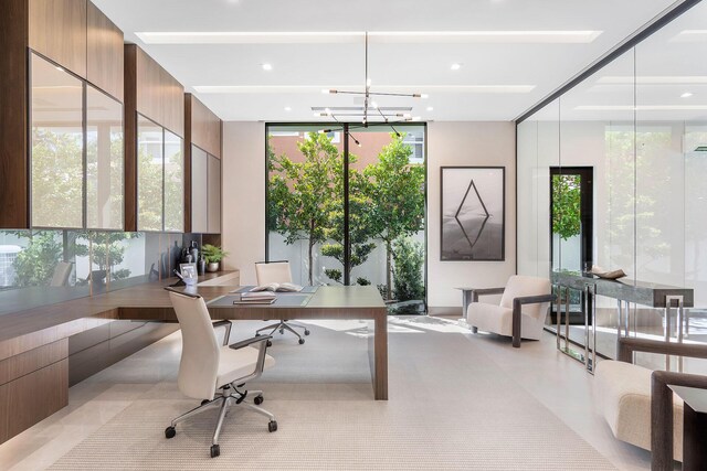 home office featuring a wealth of natural light and a wall of windows