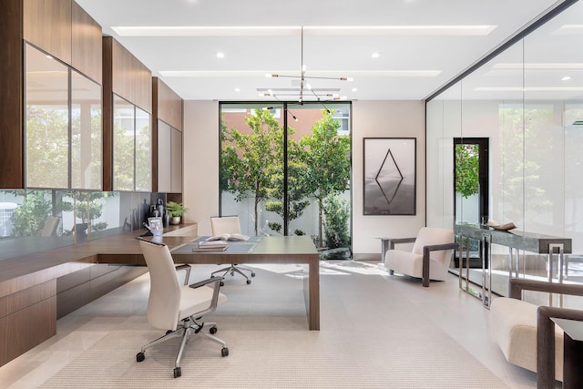 office space featuring a notable chandelier and floor to ceiling windows