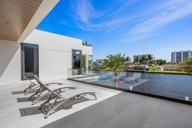 balcony featuring a water view