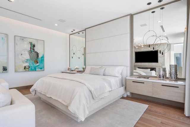 bedroom featuring light hardwood / wood-style flooring