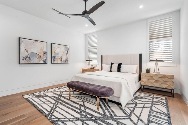 bedroom featuring hardwood / wood-style flooring and ceiling fan