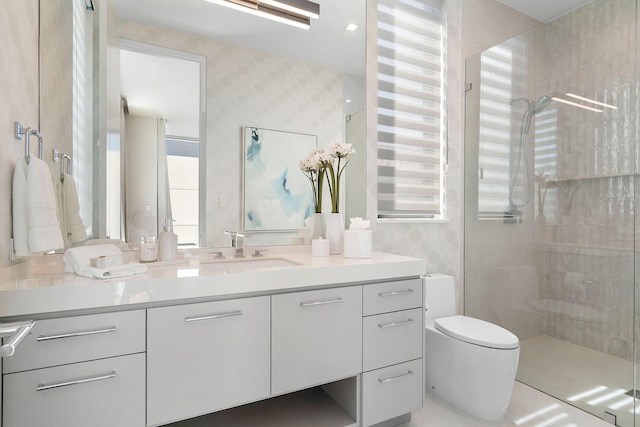 bathroom with vanity, an enclosed shower, and toilet