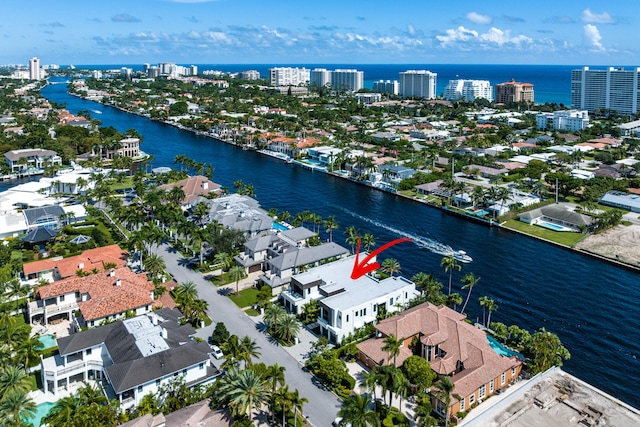 birds eye view of property featuring a water view