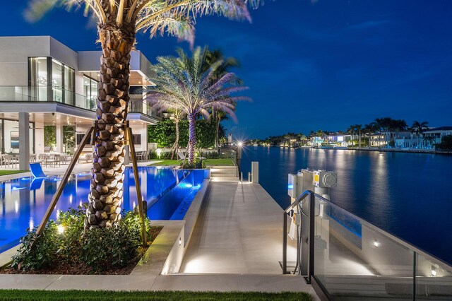 exterior space featuring a water view and a patio area