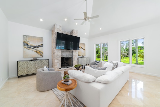 living room with a fireplace, high vaulted ceiling, light tile patterned floors, and ceiling fan