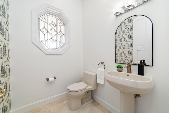 bathroom featuring tile patterned floors and toilet