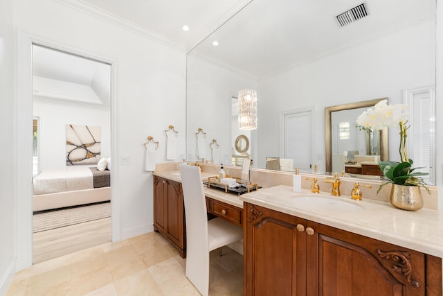 bathroom featuring vanity, tile patterned flooring, and crown molding