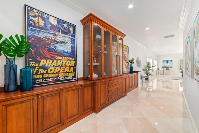 hallway featuring crown molding