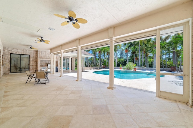 view of pool featuring a patio and ceiling fan