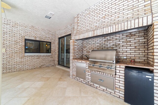 hallway with crown molding and light tile patterned floors