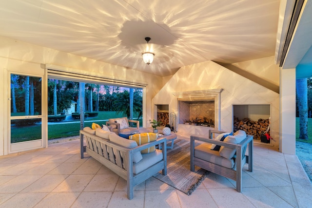 view of patio / terrace featuring an outdoor living space with a fireplace