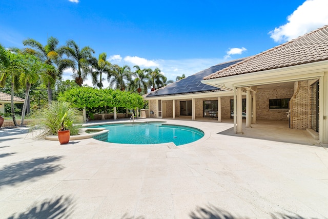 view of swimming pool with a patio