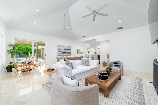 living room featuring ceiling fan, high vaulted ceiling, and a healthy amount of sunlight