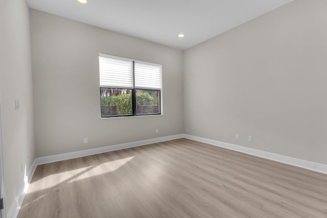 spare room with light hardwood / wood-style flooring