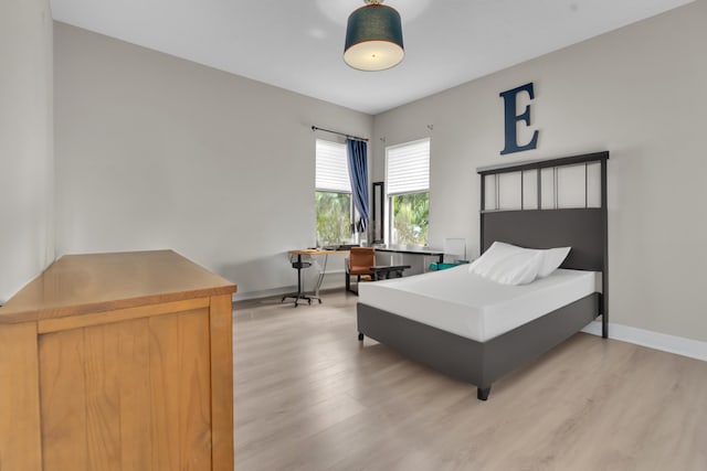 bedroom with light wood-type flooring