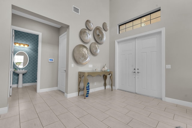 entrance foyer with visible vents and baseboards