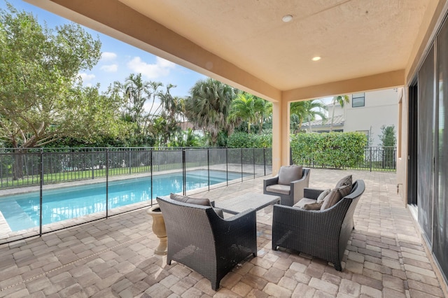 view of swimming pool featuring a patio and outdoor lounge area