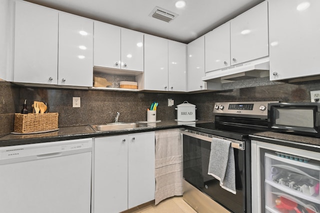 kitchen with white cabinetry, stainless steel range with electric stovetop, backsplash, white dishwasher, and sink