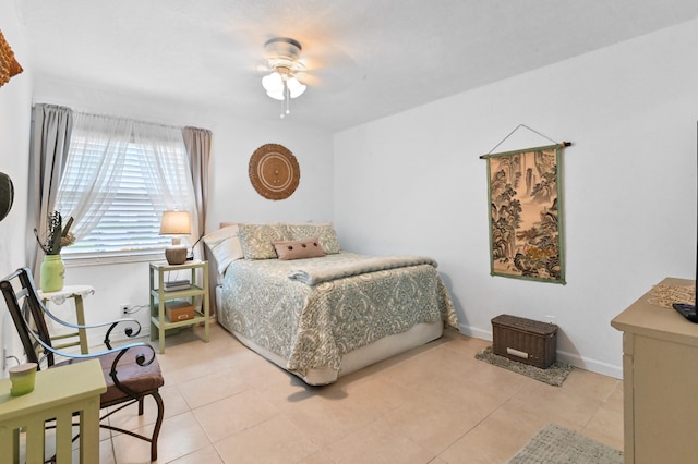 bedroom featuring ceiling fan and light tile patterned floors