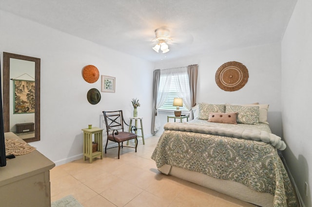 tiled bedroom featuring ceiling fan