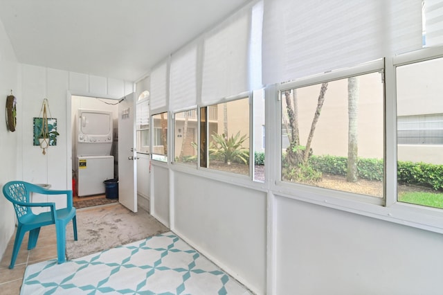 389 Capri I, Delray Beach, FL 33484 - sunroom featuring stacked washing maching and dryer