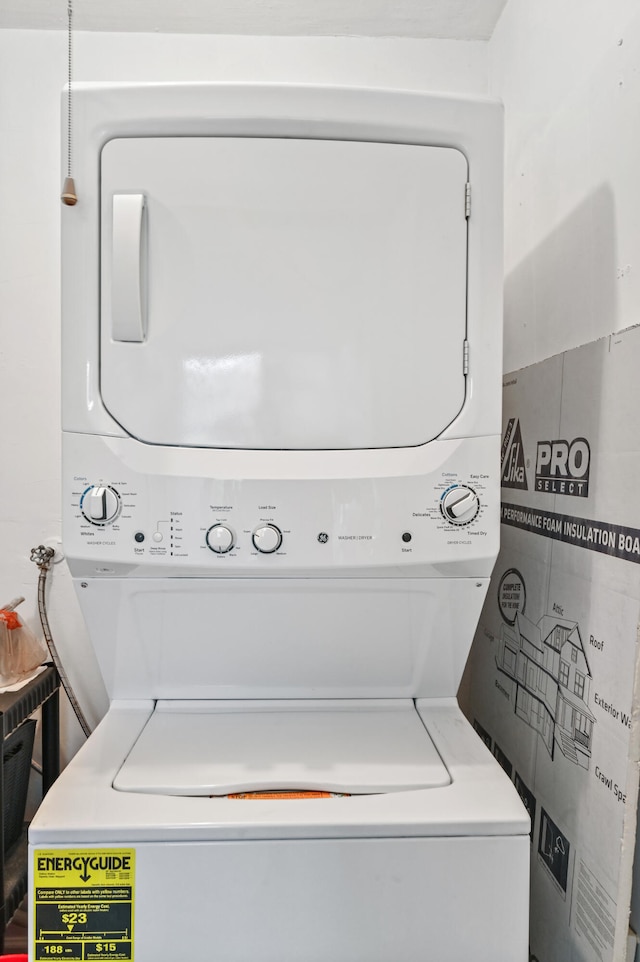 laundry room featuring stacked washer / dryer