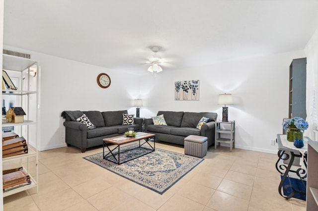 living room featuring light tile patterned flooring and ceiling fan