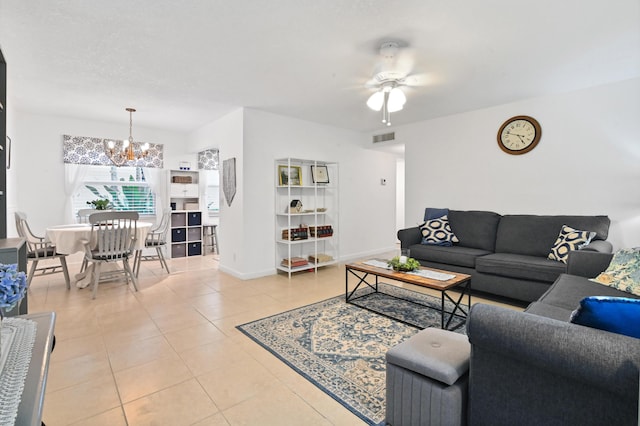 389 Capri I, Delray Beach, FL 33484 - tiled living room featuring ceiling fan with notable chandelier