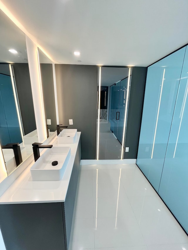 bathroom featuring dual vanity and tile patterned flooring