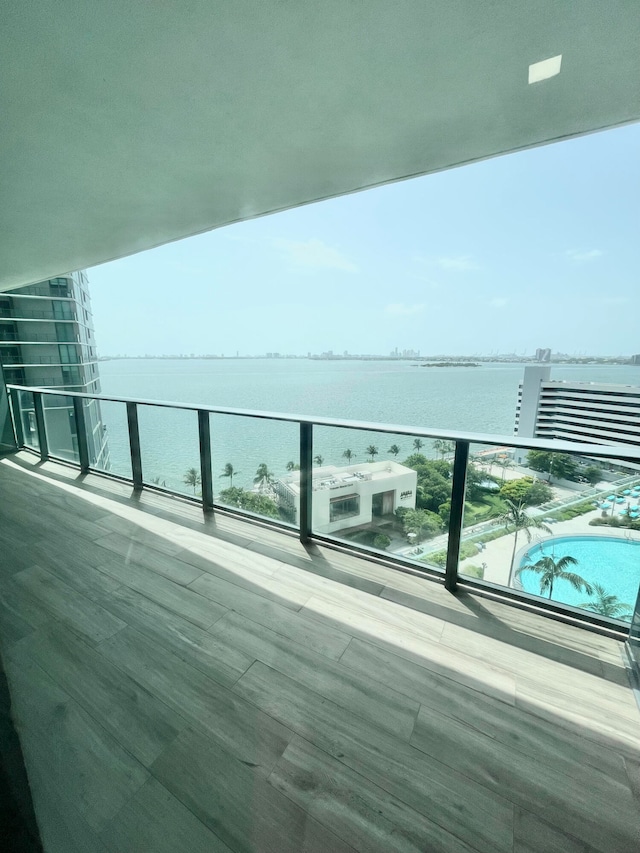 balcony featuring a water view