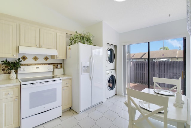 kitchen with stacked washer and clothes dryer, light tile patterned floors, white appliances, and decorative backsplash