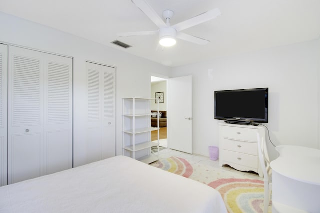 bedroom featuring light tile patterned floors and ceiling fan