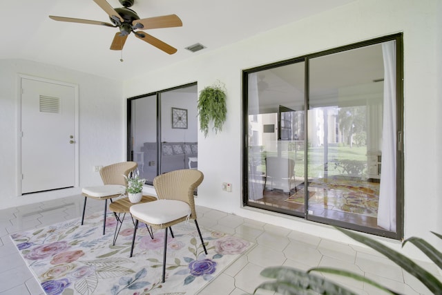 sitting room featuring ceiling fan