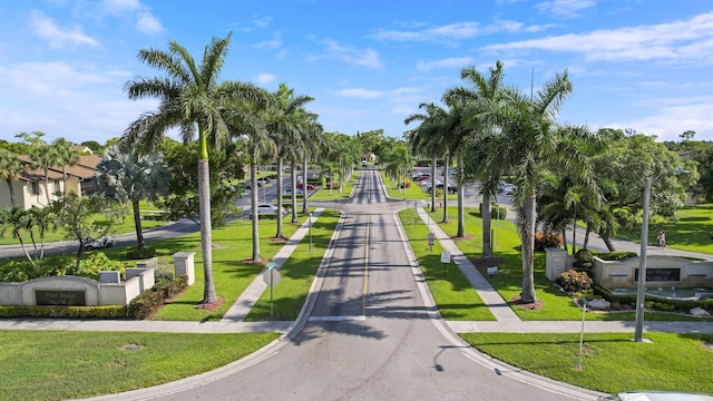 view of property's community featuring a yard